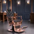 Clovis gold barber chair - luxury barber chair - golden barber chair - vintage barbershop chair - high-end barber furniture - professional hairdressing chair - hydraulic barber chair - upholstered barber chair - robust barber chair - golden design barber chair - luxury retro barber chair - premium barbershop equipment - comfortable barber chair - adjustable barber chair - golden aluminum barber chair