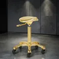 Professional aesthetic stool - Ergonomic beautician seat - Hydraulic treatment stool - Beauty salon furniture - Professional swivel stool - Wheeled massage seat - Manicure pedicure stool - Aesthetic institute equipment - Padded seat stool - High-end aesthetic furniture - Professional hairdressing stool - Wheeled aesthetic stool - Saddle stool - Professional sit-stand seat - Hairdressing and beauty furniture - Ergonomic stool with backrest - Gas lift height adjustment - High-density resilient foam - Chrome star base - Anti-hair casters - Hairdresser cutting stool - Tattoo artist stool - Massage and treatment seat - Manicure and pedicure stool - Washable faux leather upholstery