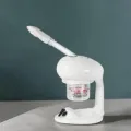 Professional facial steamer - face steamer device - ozone steamer - ionic hot steam - cold face spray - double steam arm - facial treatment device - aesthetic steamer - hot and cold steam machine - facial aromatherapy device - essential oil diffuser - beauty salon steam machine - mobile steamer with wheels - adjustable steam device - high-precision steamer - beauty institute steam machine - professional ozone steam device - modern facial steamer - facial thermal treatment device - spa cabin steamer - 0.9 L steam machine - hot and cold steam device - high-end aesthetic steamer.