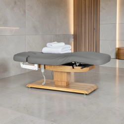 Sillon Relax Grey Wood Light (1).webp Sillon Relax care table – electric SPA table – light wood massage table – ergonomic care bed – professional aesthetic table – adjustable spa table – segmented SPA mattress – electric spa table – high-end wellness furniture – stable spa table – premium aesthetic table – tiltable care bed – modern spa table – aesthetic salon equipment – comfortable massage table