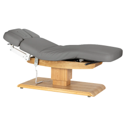 Sillon Relax Gris Bois Clair (2).webp Sillon Relax care table – electric SPA table – light wood massage table – ergonomic care bed – professional aesthetic table – adjustable spa table – segmented SPA mattress – electric spa table – high-end wellness furniture – stable spa table – premium aesthetic table – tiltable care bed – modern spa table – aesthetic salon equipment – comfortable massage table