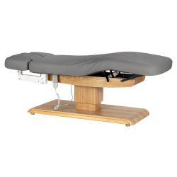 Sillon Relax Gris Bois Clair (4).webp Sillon Relax care table – electric SPA table – light wood massage table – ergonomic care bed – professional aesthetic table – adjustable spa table – segmented SPA mattress – electric spa table – high-end wellness furniture – stable spa table – premium aesthetic table – tiltable care bed – modern spa table – aesthetic salon equipment – comfortable massage table