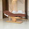 Sillon Relax Brown Wood Light (1) Sillon Relax care table – electric SPA table – light wood massage table – ergonomic care bed – professional aesthetic table – adjustable spa table – segmented SPA mattress – electric spa table – high-end wellness furniture – stable spa table – premium aesthetic table – tiltable care bed – modern spa table – aesthetic salon equipment – comfortable massage table
